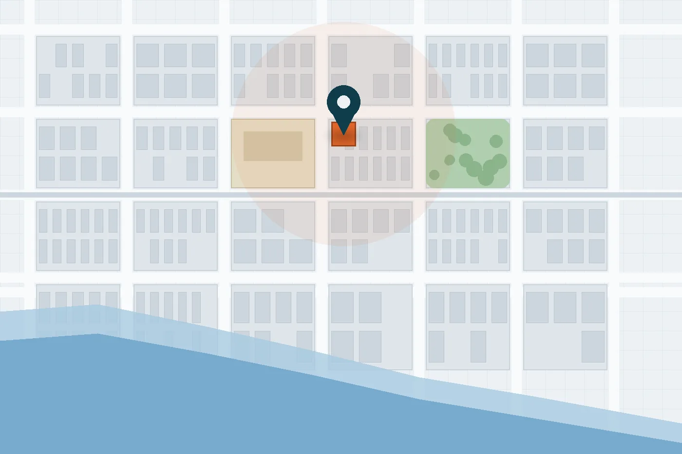 A street plan with one plot marked and a circle drawn around it, a river along the bottom